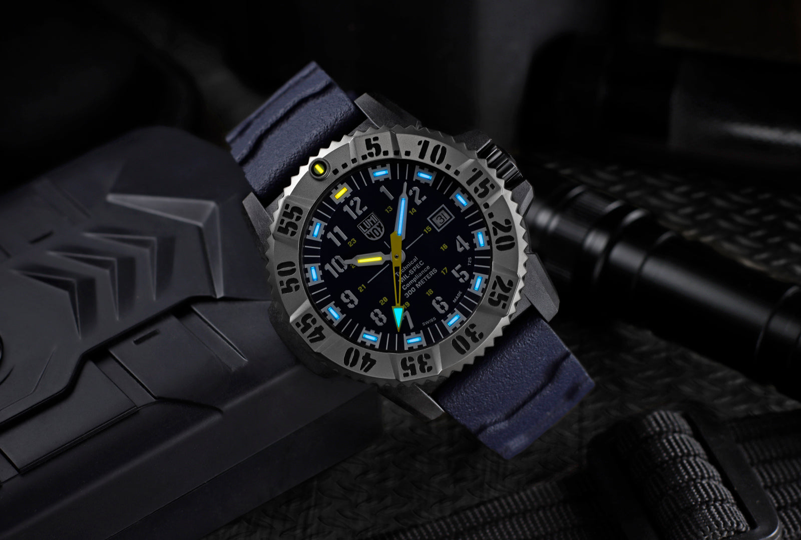 Watch with blue strap on a dark textured background