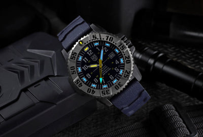 Watch with blue strap on a dark textured background